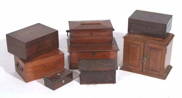 Appraisal: AN EBONISED OAK CORNER CABINET with glazed doors above and