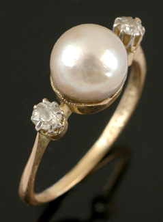 Appraisal: An Australian pearl and diamond ring Centrally set with a