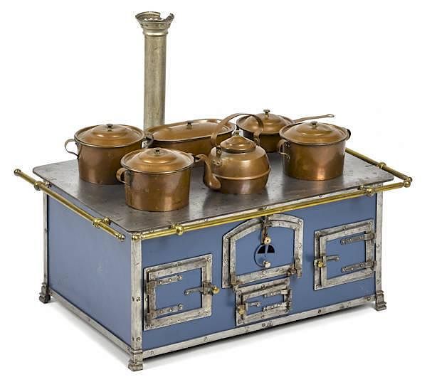 Appraisal: Cast iron nickel and brass toy stove with origi Cast