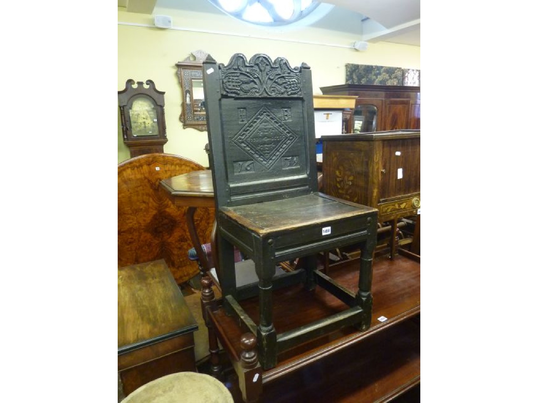 Appraisal: A th century oak side chair with geometric carved floral