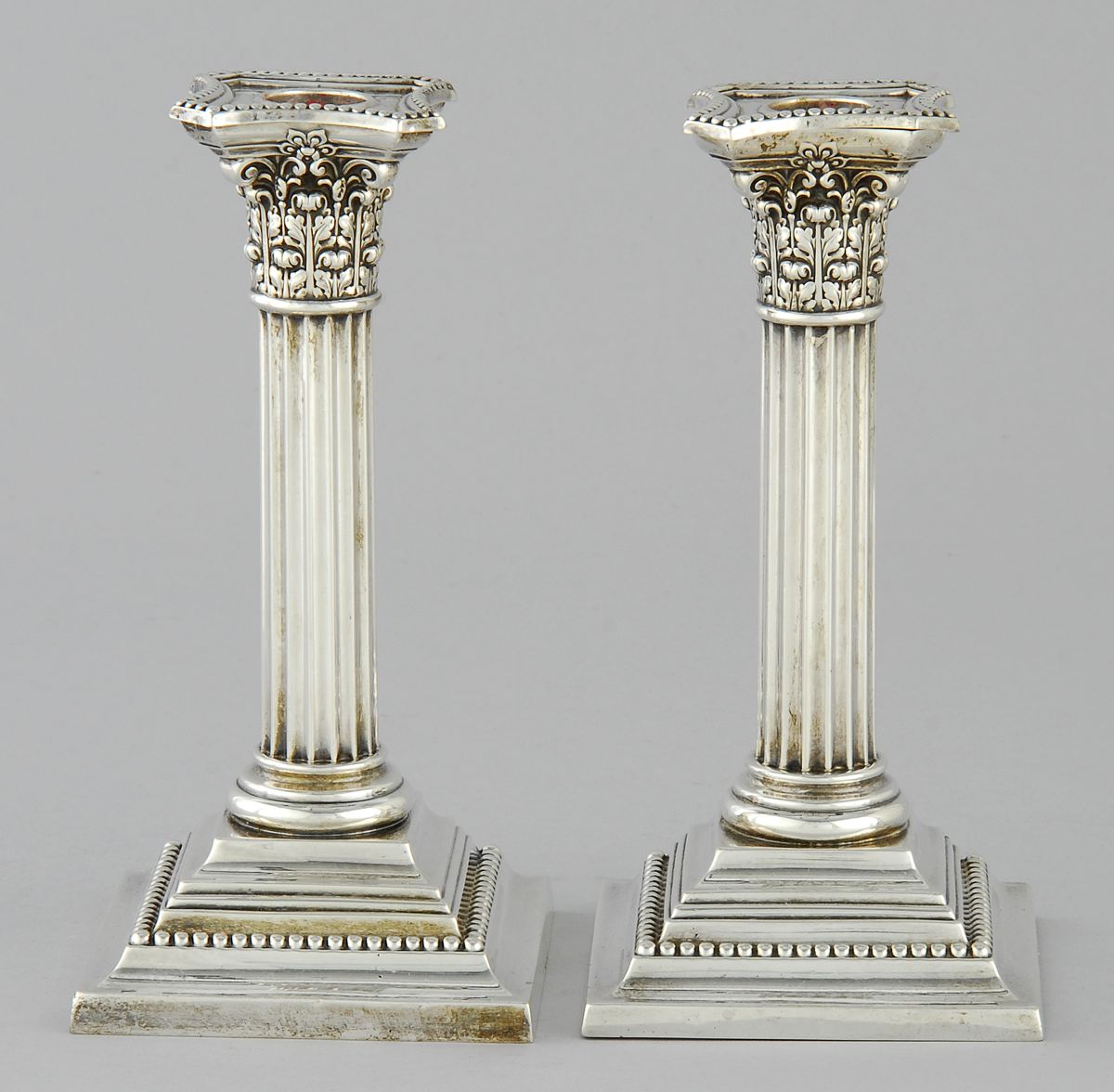 Appraisal: PAIR OF GORHAM STERLING SILVER WEIGHTED CANDLESTICKS In Corinthian column-form