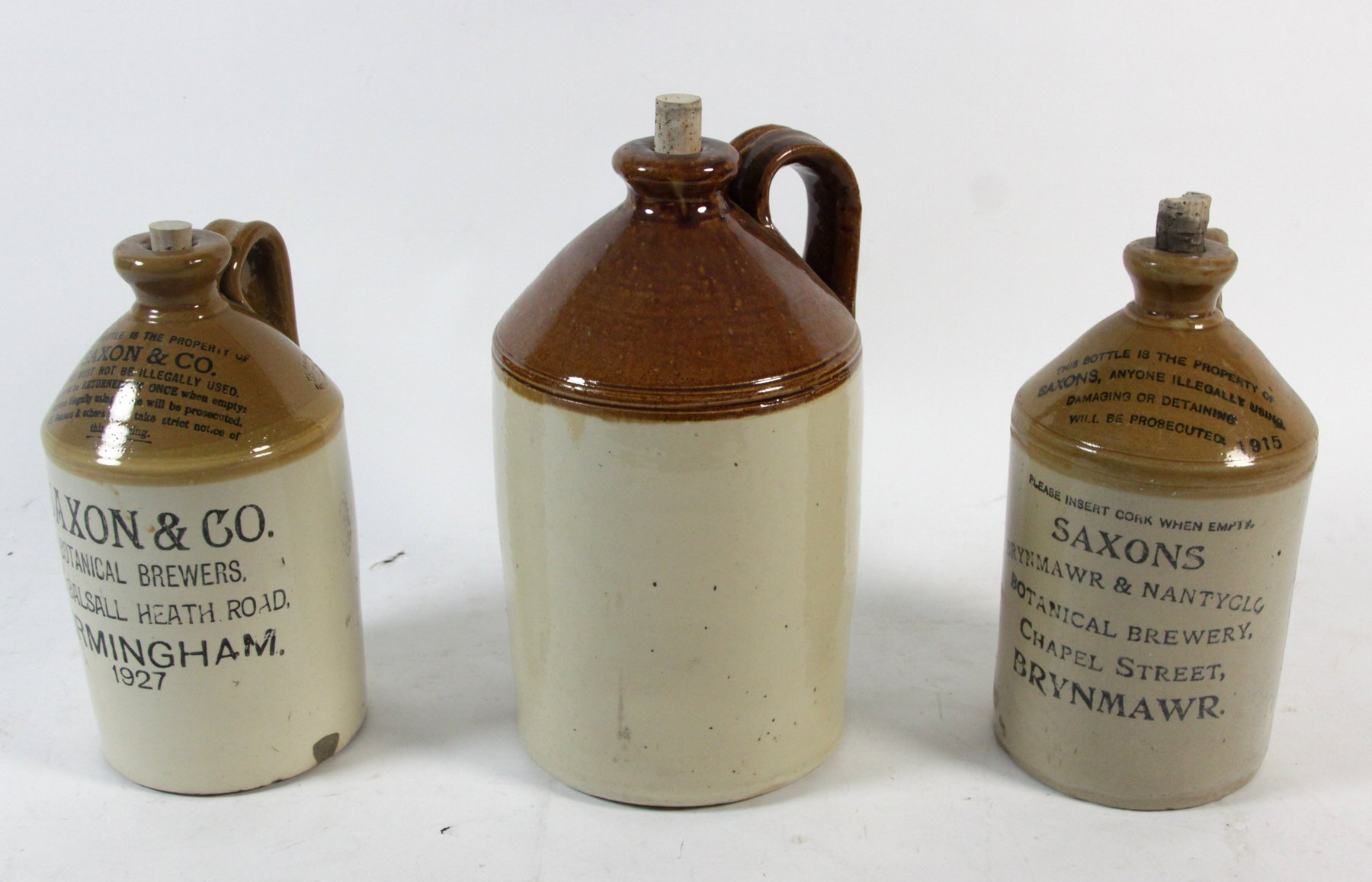 Appraisal: Two Saxon Co Brewery stoneware jars each cm high and