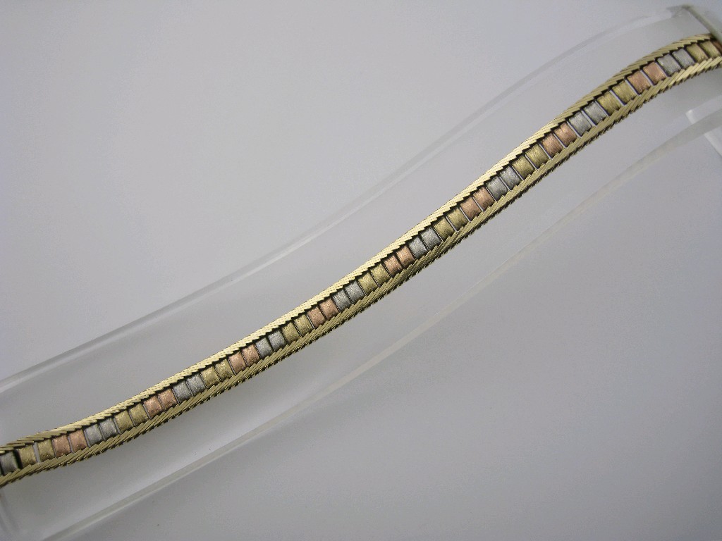 Appraisal: A three coloured ct gold flexible link Bracelet approx gms