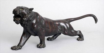 Appraisal: JAPANESE BRONZE-PATINATED FIGURE OF A STALKING TIGER With head raised