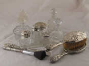 Appraisal: A silver dressing table set comprising hair brush dusting brush