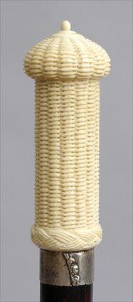 Appraisal: IVORY-HANDLED FRUITWOOD WALKING STICK The cylindrical basketweave handle with twist-off