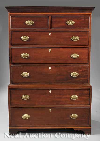 Appraisal: An Antique American Chippendale-Style Mahogany Chest-on-Chest having a cove-molded cornice