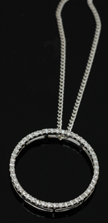 Appraisal: A circular diamond pendant The fine open circle set with