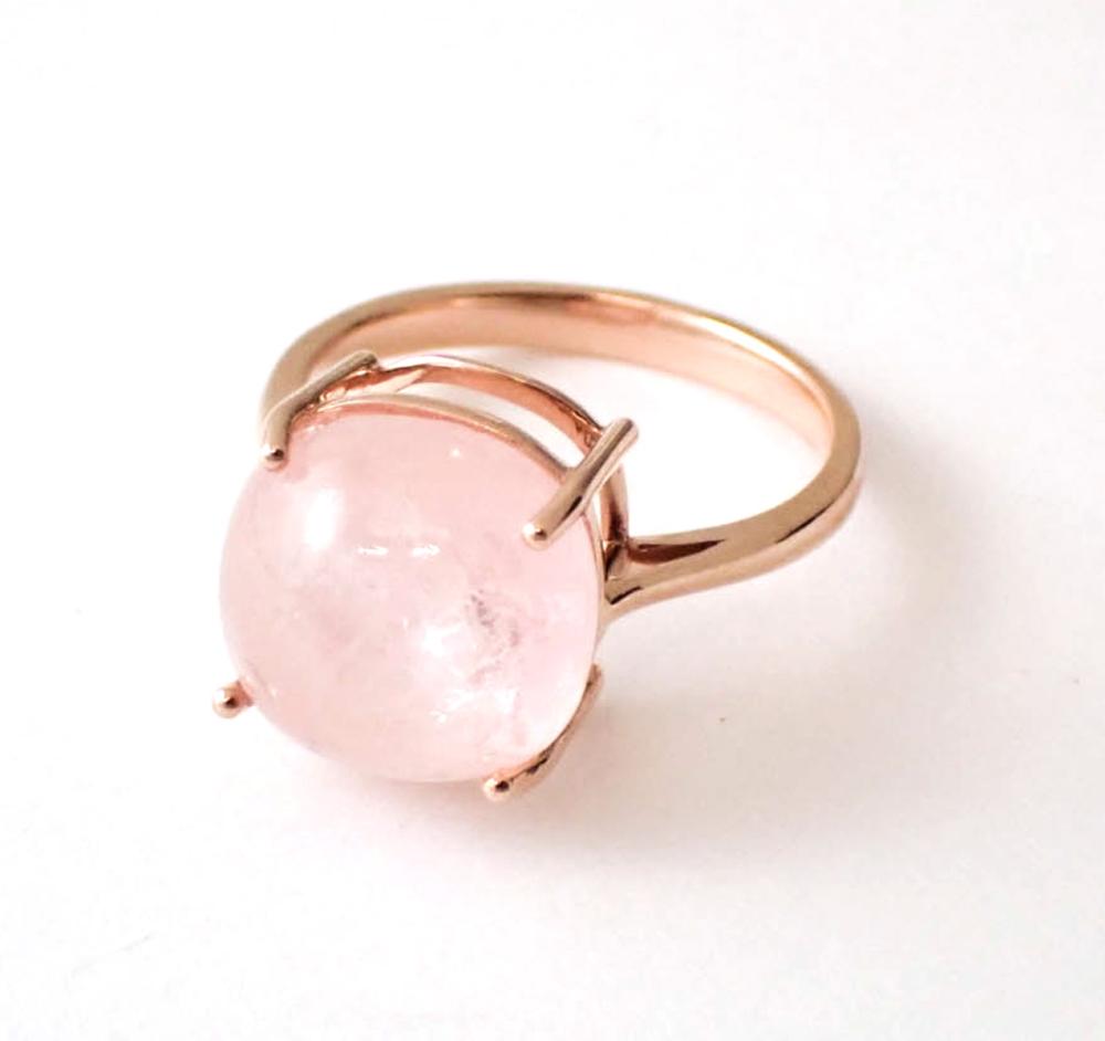 Appraisal: ROSE QUARTZ AND FOURTEEN KARAT ROSE GOLD RING The solitaire