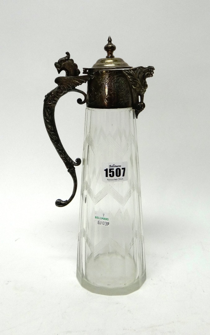 Appraisal: A silver plated metal mounted faceted glass claret jug circa