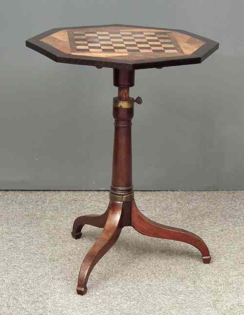 Appraisal: A mahogany octagonal tripod table with inlaid chessboard pattern top