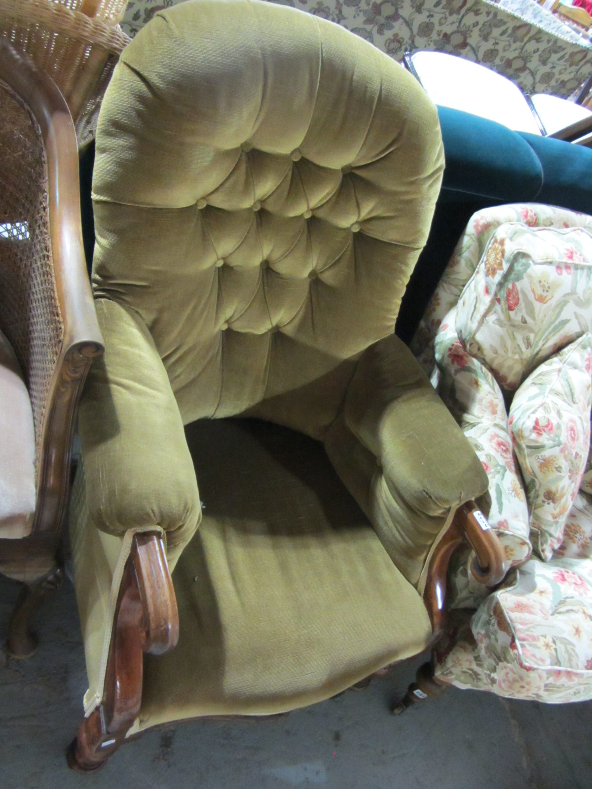 Appraisal: A th century mahogany button back armchair