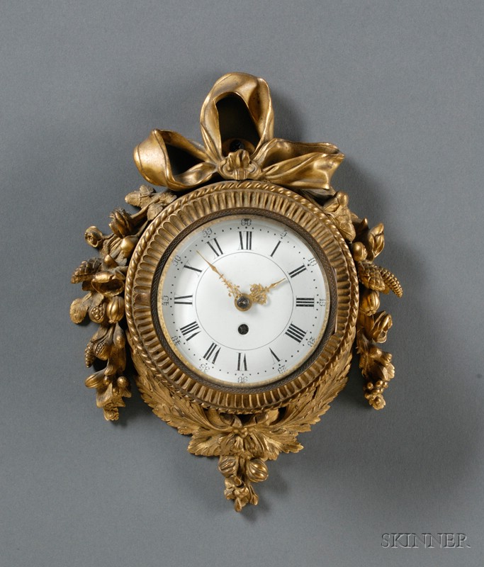 Appraisal: Neoclassical Gilt Brass Cartel-style Clock Germany with cast floral swags