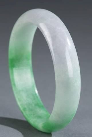 Appraisal: Chinese carved jade bracelet A Chinese carved jade bracelet Light