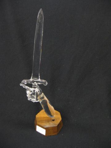 Appraisal: Figural Crystal Statue of Arm Sword plus wooden base excellent