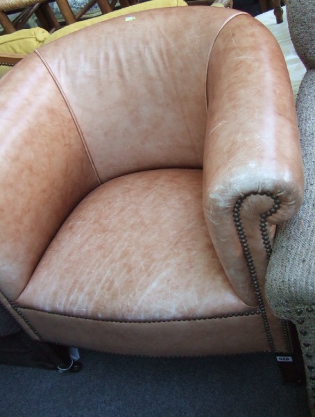 Appraisal: A late th century oak framed tub chair with studded