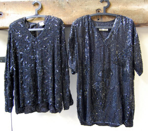 Appraisal: Two black heavily beaded and sequinned evening tops by Oliver