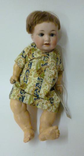 Appraisal: An Armand Marseille bisque head character doll blue glass sleeping