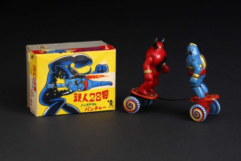 Appraisal: Tetsujin Fighting Spring Toy Description Japanese Made by Bandai Working