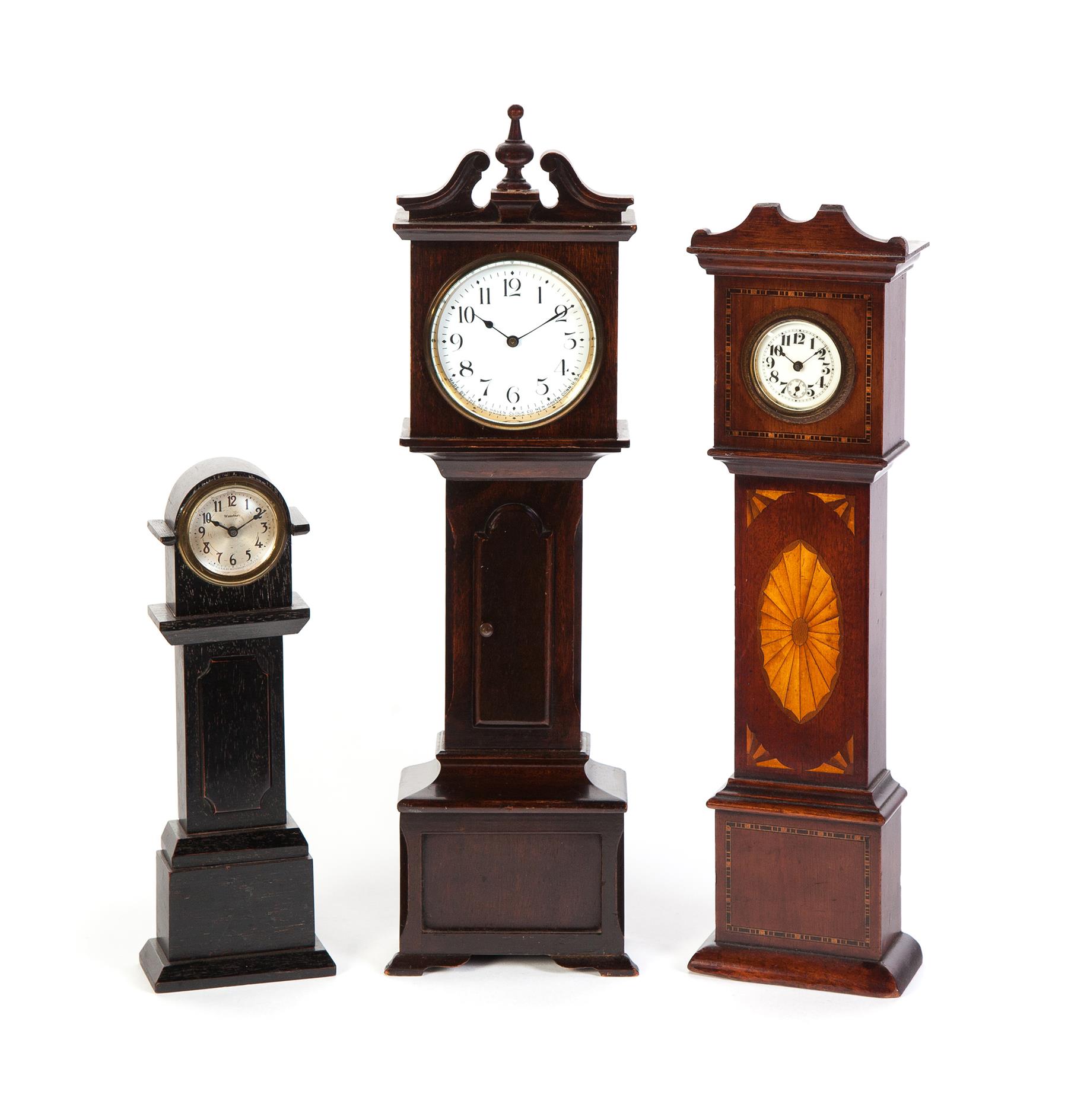 Appraisal: THREE MINIATURE TALL CASE CLOCKS American ca Waterbury Clock Company