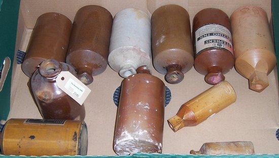 Appraisal: A quantity of stoneware ink bottles various with spouts