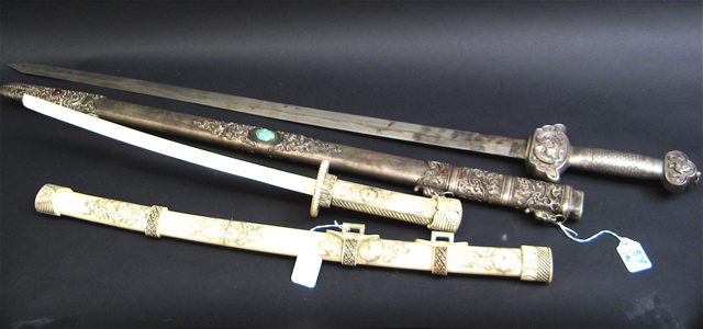 Appraisal: TWO TH CENTURY CHINESE SWORDS with scabbards the first carved