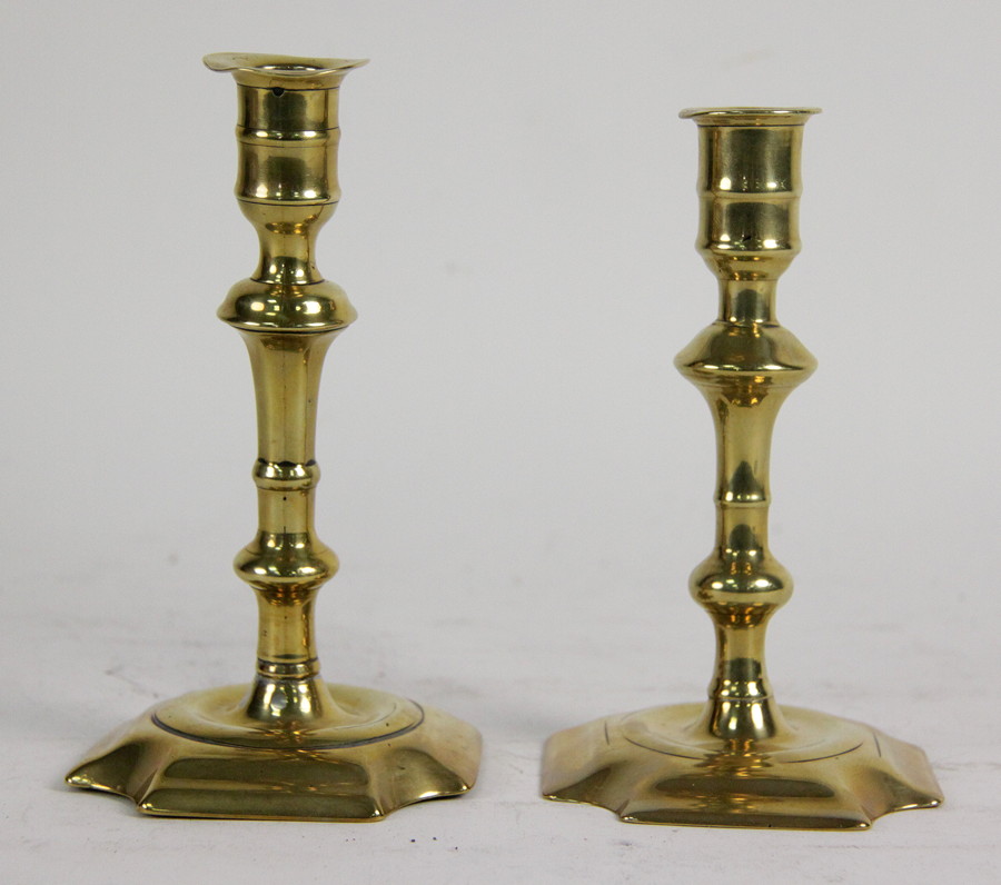 Appraisal: A near pair of Georgian brass candlesticks each of knopped