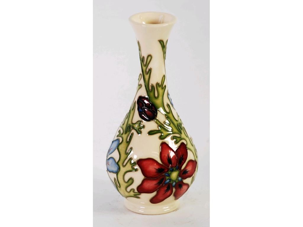 Appraisal: MODERN MOORCROFT TUBE LINED POTTERY VASE of compressed oviform and