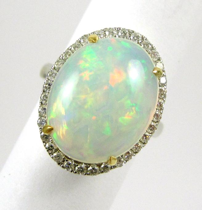 Appraisal: OPAL DIAMOND AND FOURTEEN KARAT GOLD RING The white gold