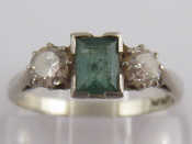 Appraisal: A white metal tests platinum emerald and diamond ring the