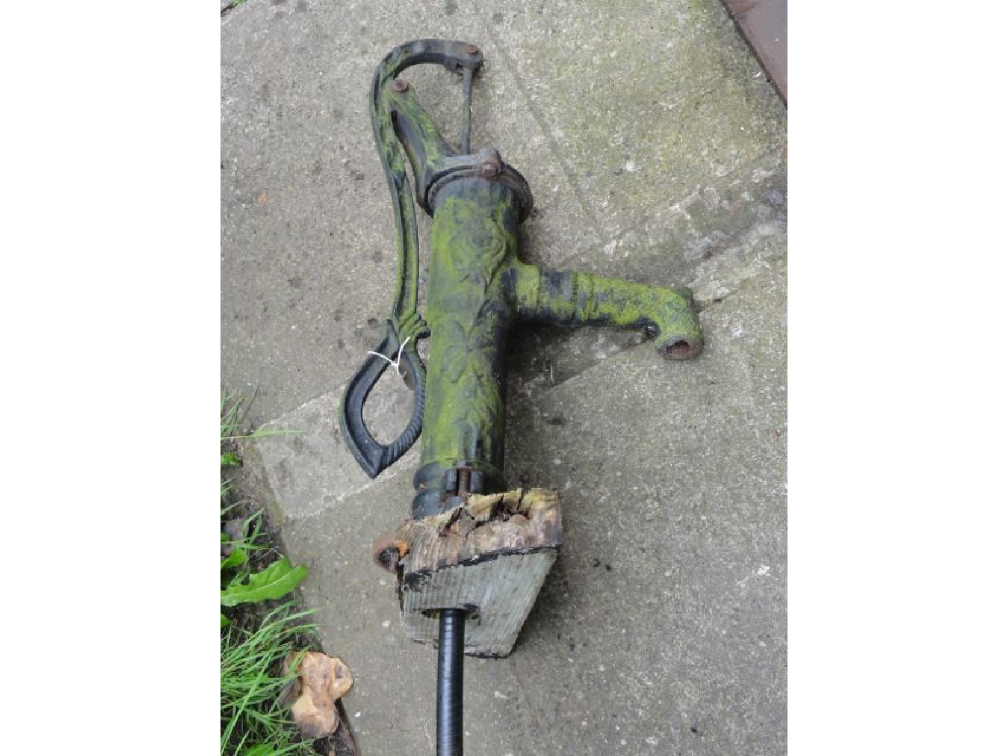 Appraisal: A Victorian style cast iron water pump with raised relief