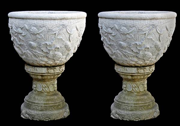 Appraisal: The urns with rolled rim above a vessel carved with