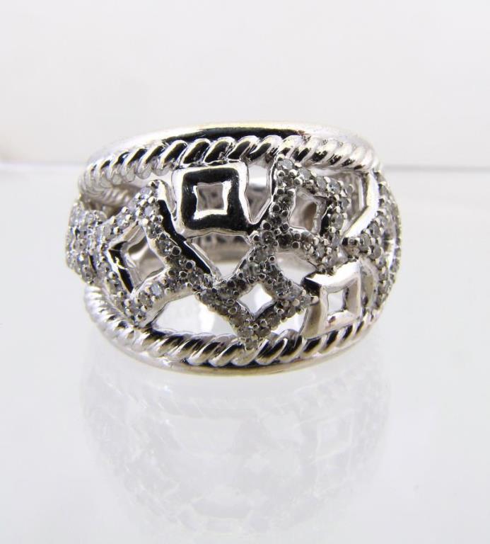 Appraisal: A David Yurman sterling silver quatrefoil design diamond band ring