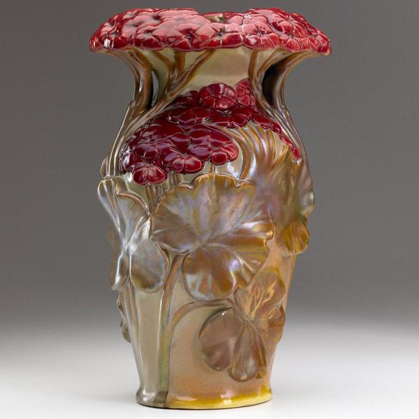 Appraisal: ZSOLNAY Fine vase embossed with red geraniums and golden leaves