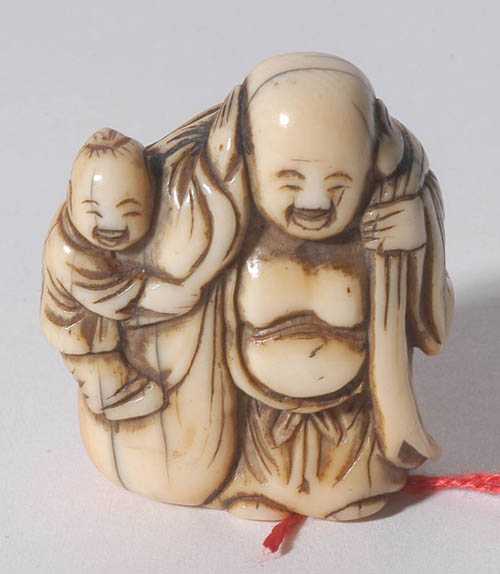 Appraisal: NETSUKE Japan th century H cm Ivory with honey-coloured patina