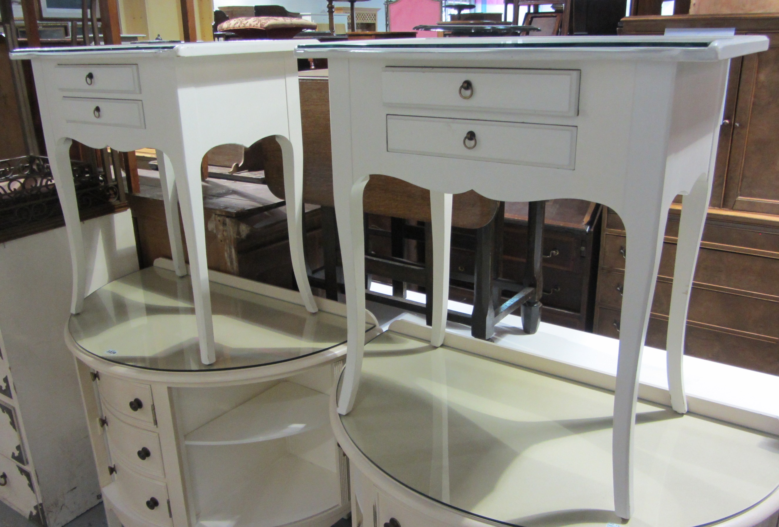 Appraisal: A pair of th century white bedside cabinets with two