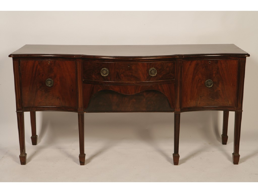 Appraisal: A LATE GEORGE III MAHOGANY SERPENTINE SIDEBOARD the moulded top