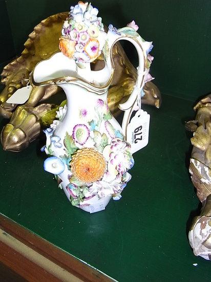 Appraisal: A CONTINENTAL JUG and stopper with all over applied flower