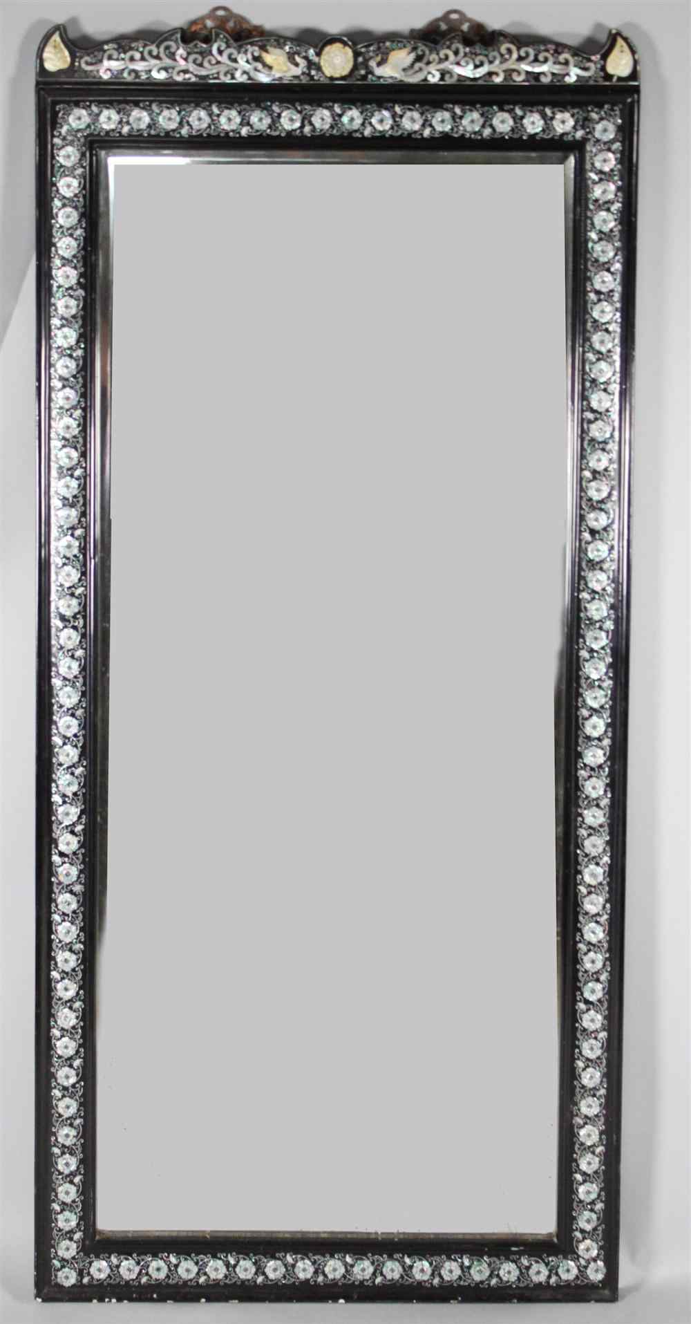 Appraisal: ASIAN MOTHER-OF-PEARL-INLAID HARDWOOD MIRROR of elongated rectangular shape with shaped