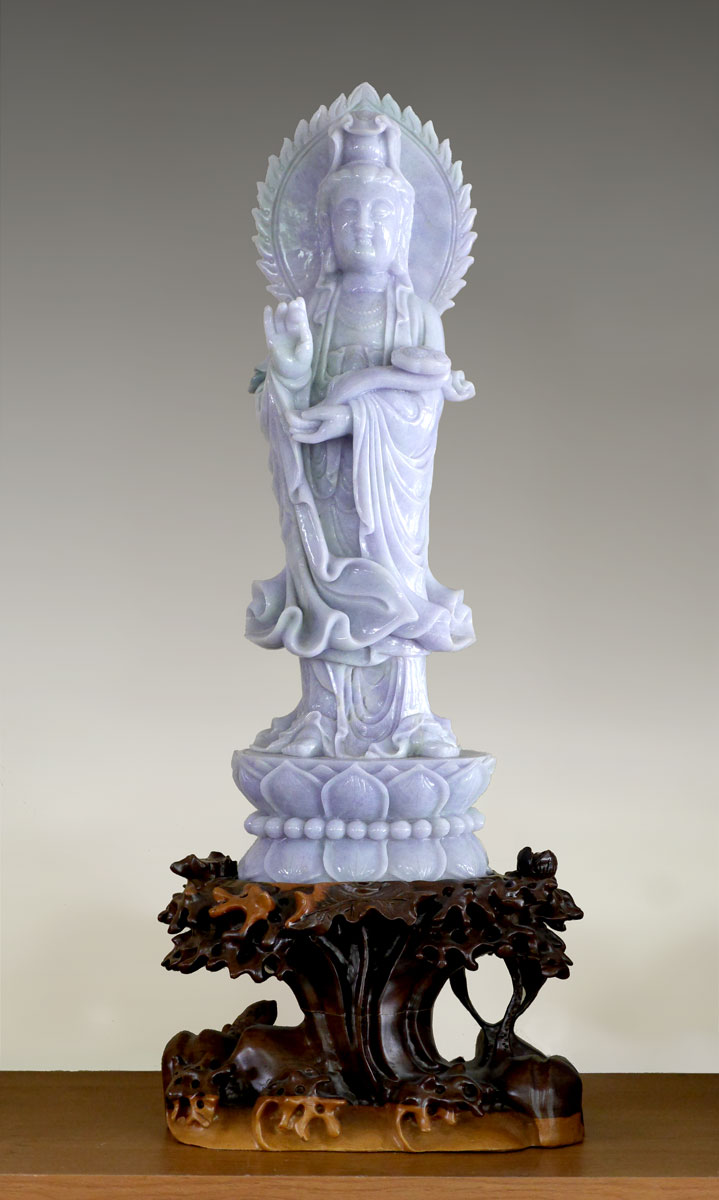 Appraisal: LARGE CHINESE CARVED JADEITE FIGURE OF GUAN YIN Apple green