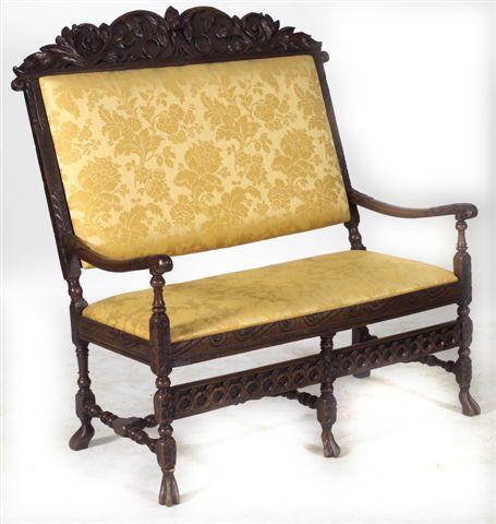 Appraisal: CAROLEAN STYLE OAK AND WALNUT SETTEE the padded back with