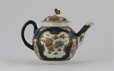 Appraisal: A Worcester teapot and cover with a floral finial painted