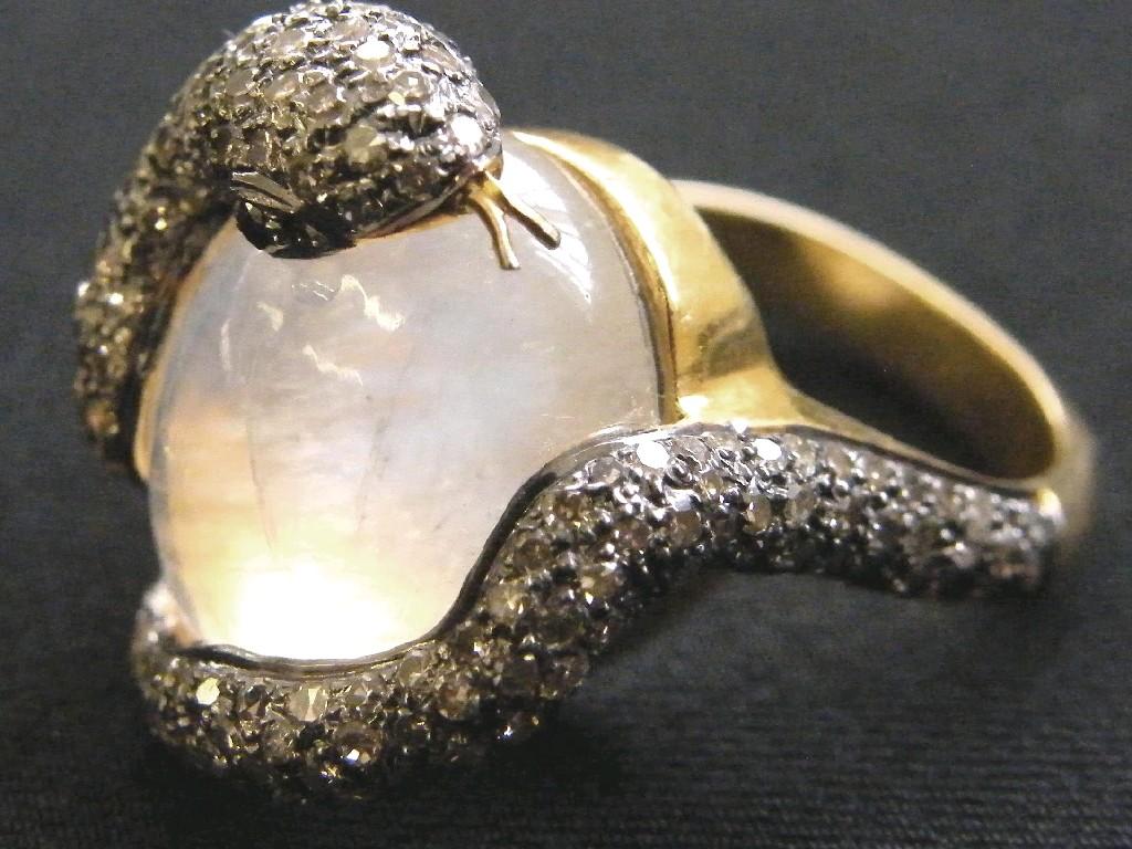 Appraisal: Unusual gold diamond and moonstone snake design ring ct approx