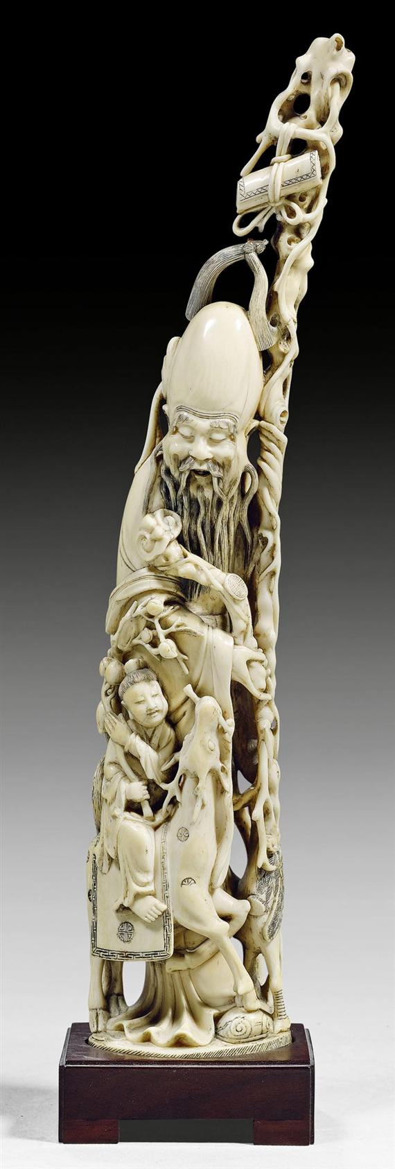 Appraisal: AN IVORY CARVING OF SHOULAO AND A BOY ASTRIDE A