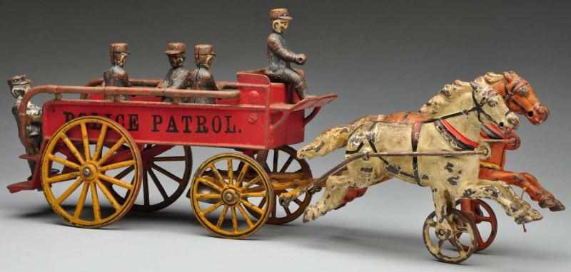 Appraisal: Cast Iron Harris Police Patrol Horse-Drawn Toy Description American Includes