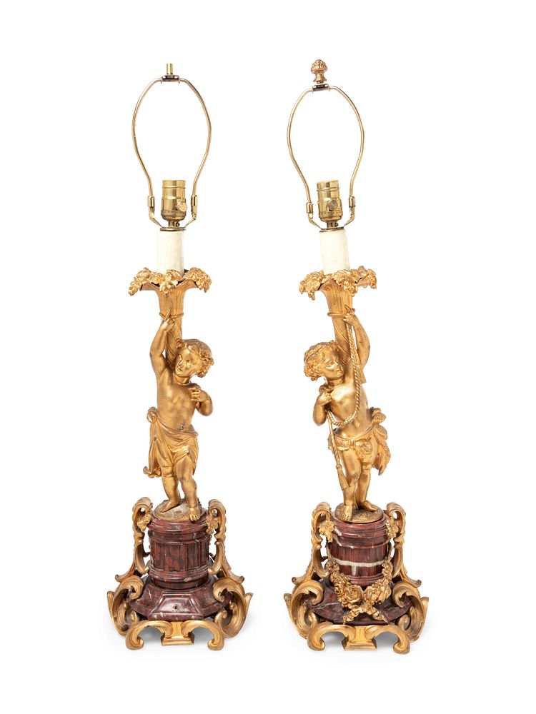 Appraisal: A Pair of Louis XV Style Gilt Bronze Figural Candlesticks