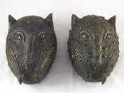 Appraisal: A pair of Benin bronze leopard's heads Nigeria x cm