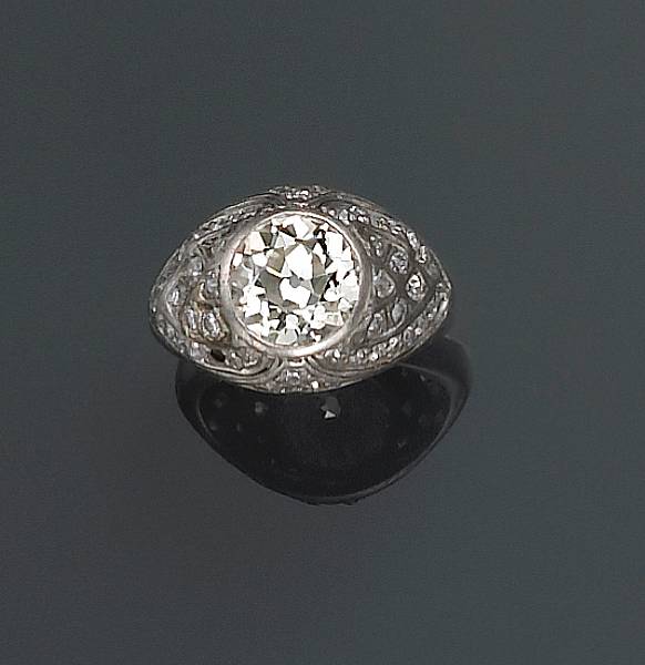 Appraisal: A diamond ring centering a European-cut diamond weighing approximately carats