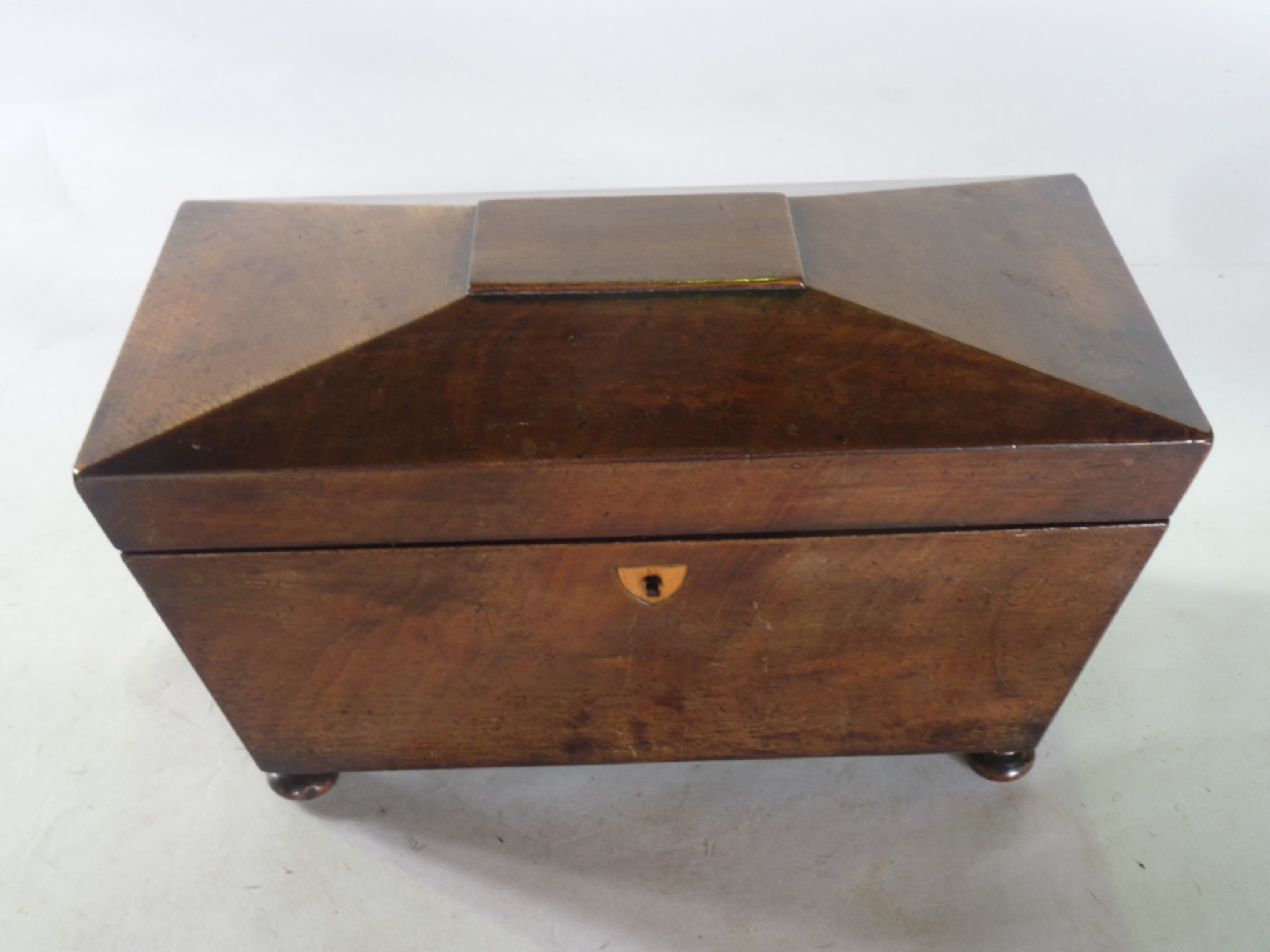 Appraisal: A th century sarcophagus shaped tea caddy veneered principally in