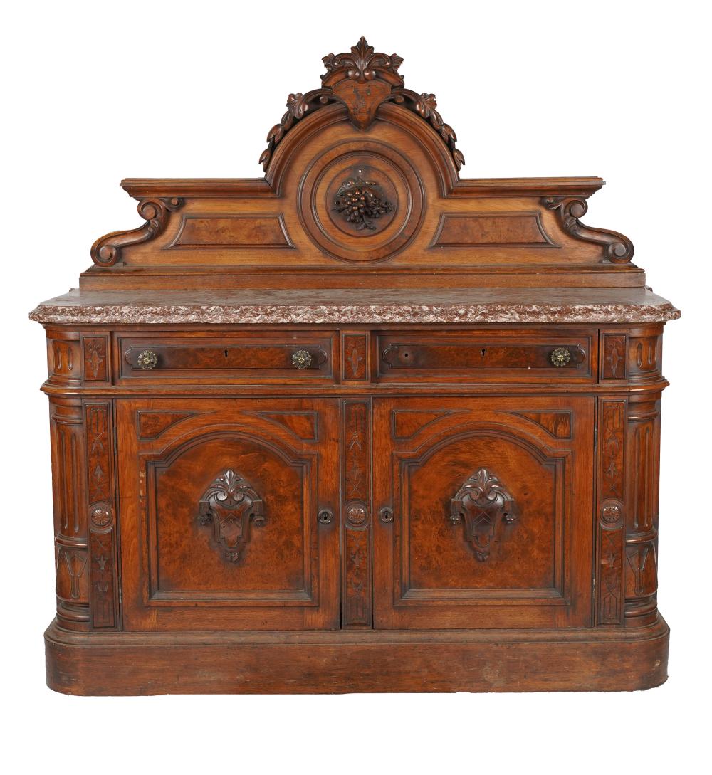 Appraisal: CARVED WALNUT MARBLE-TOP SIDE CABINET th century each hinged door